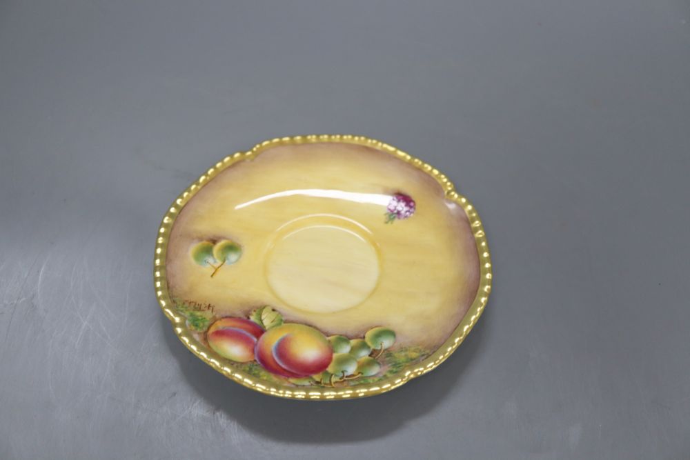 A Royal Worcester fruit painted cup and saucer, saucer signed L K Till, cup signed A Kendry